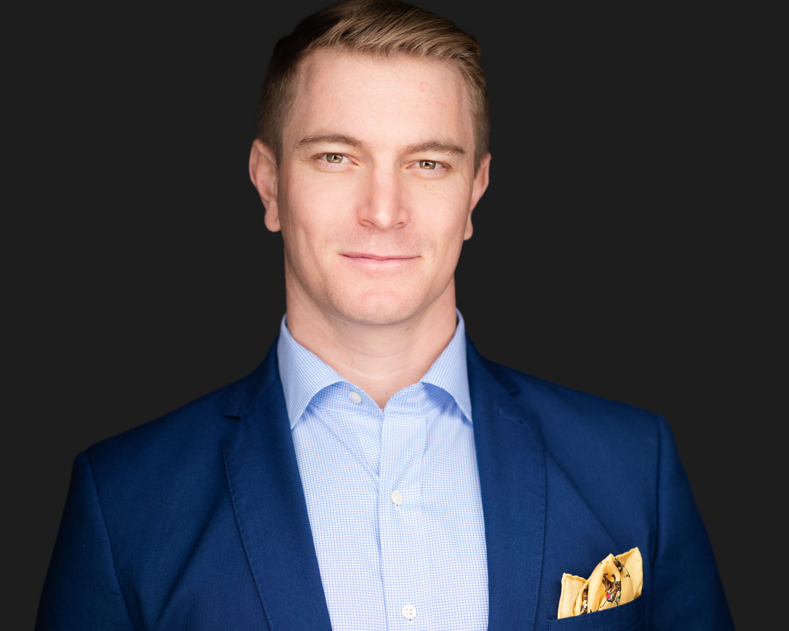 Las Vegas headshot photographer — young professional man navy suit corporate studio portrait